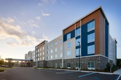a rendering of a building with a parking lot at Hilton Garden Inn Panama City Airport, Fl in Panama City