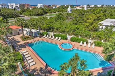 an overhead view of a swimming pool with palm trees at Ocean View Condo Btwn Rosemary and Alys Beach! in Rosemary Beach