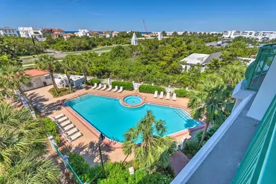 an overhead view of a swimming pool with palm trees at Ocean View Condo Btwn Rosemary and Alys Beach! in Rosemary Beach