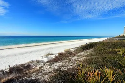 an empty beach with the ocean in the background at Rollin Tide Villas- Rollin Tide B9 in Santa Rosa Beach