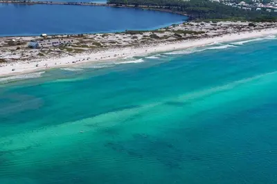 an aerial view of a beach with people in the water at Rollin Tide Villas- Rollin Tide B9 in Santa Rosa Beach