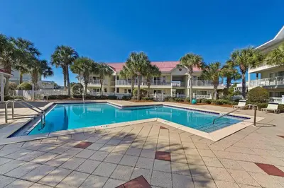 a swimming pool in front of a large building at Rollin Tide Villas- Rollin Tide B9 in Santa Rosa Beach