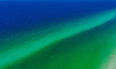 an underwater view of the ocean with green water at Ocean Air Upper West Private Beach Unit on 30A in Santa Rosa Beach