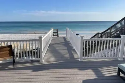 a white boardwalk leading to a beach with the ocean at Ocean Air Lower West Private Beach Unit on 30A in Santa Rosa Beach