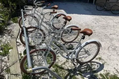 a group of bikes parked next to each other at Ocean Air Lower West Private Beach Unit on 30A in Santa Rosa Beach