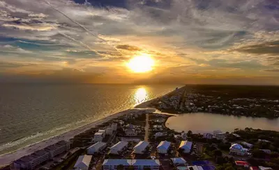 an aerial view of a beach at sunset at Ocean Air Lower West Private Beach Unit on 30A in Santa Rosa Beach