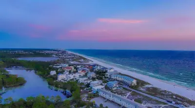 an aerial view of a beach at sunset at Ocean Air Lower West Private Beach Unit on 30A in Santa Rosa Beach