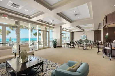 a living room with a view of the ocean at Aqua Resort 1705 in Panama City Beach