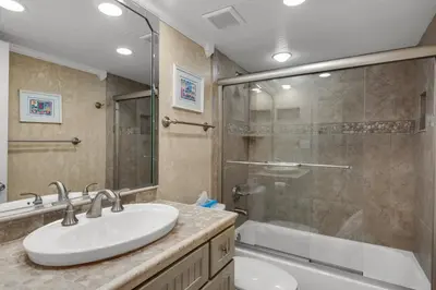 a bathroom with a sink and a shower at 111 The Shores in Sunnyside
