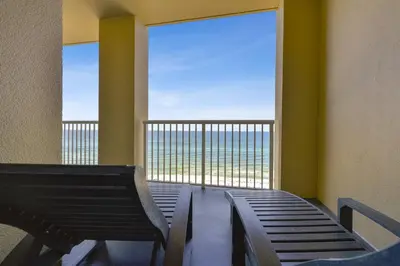 a room with a bench and a large window at Grand Panama Beach Resort #908-1 by Book That Condo in Panama City Beach