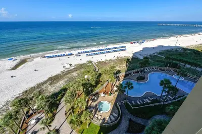 an aerial view of the beach and a train on the beach at Grand Panama Beach Resort #908-1 by Book That Condo in Panama City Beach