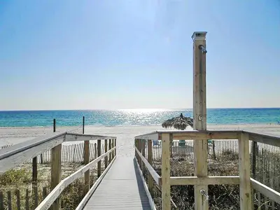 a wooden boardwalk leading to the beach with the ocean at Grandview East 302 - Sandscape in Panama City Beach