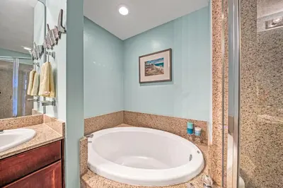 a bathroom with a large tub and a sink at On the 3-d Floor, Laketown 324 - Large 2 BD , Great Views and Amenities in Panama City Beach