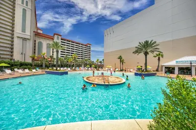 a pool at a hotel with people in the water at On the 3-d Floor, Laketown 324 - Large 2 BD , Great Views and Amenities in Panama City Beach