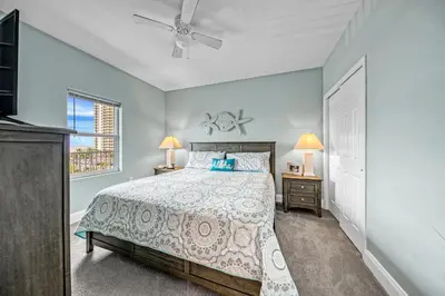 a bedroom with a bed and a ceiling fan at On the 3-d Floor, Laketown 324 - Large 2 BD , Great Views and Amenities in Panama City Beach
