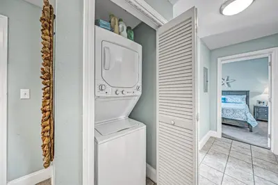 a laundry room with a washer and dryer at On the 3-d Floor, Laketown 324 - Large 2 BD , Great Views and Amenities in Panama City Beach