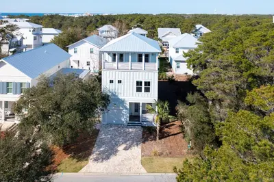 an aerial view of a large white house at Vitamin Sea in Inlet Beach