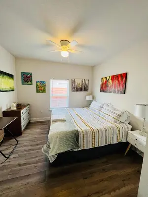 a bedroom with a bed and a ceiling fan at Beach Room, for wonderful Vacation in Panama City Beach