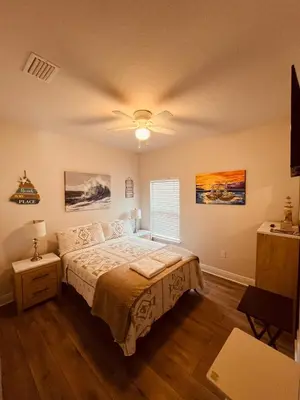 a bedroom with a bed and a ceiling fan at Beach Room, for wonderful Vacation in Panama City Beach