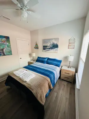 a bedroom with a bed and a ceiling fan at Beach Room, for wonderful Vacation in Panama City Beach