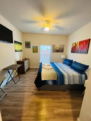 a bedroom with a bed and a ceiling fan at Beach Room, for wonderful Vacation in Panama City Beach