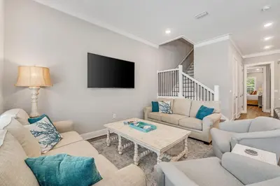 a living room with two couches and a tv at 30A Beach House - Beach Ready in Inlet Beach