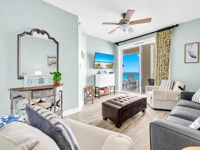 a living room with a view of the ocean at Grand Panama 1-1401 in Panama City Beach