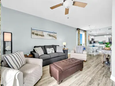 a living room with a couch and a table at Grand Panama 1-1401 in Panama City Beach