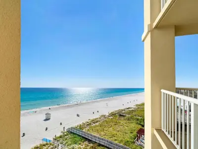 a view of the beach from a balcony of a condo at Grand Panama 1-1401 in Panama City Beach