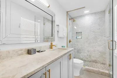 a bathroom with a sink and a toilet and a shower at Inlet Sands 206- Inlet Dreams in Panama City Beach