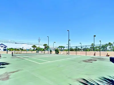 an empty tennis court with a tennis court at Summerhouse 1009B in Panama City Beach