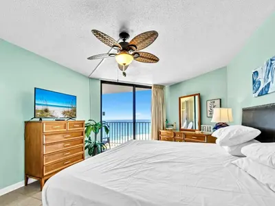a bedroom with a bed and a ceiling fan at Summerhouse 1009B in Panama City Beach