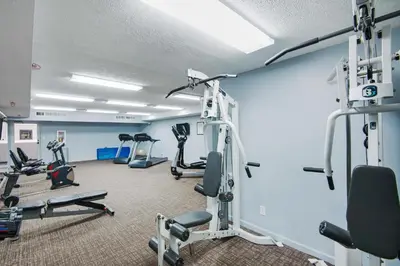 a fitness room with treadmills and ellipticals at Watercrest 103 in Panama City Beach