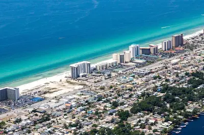 an aerial view of a beach with buildings and the ocean at Watercrest 103 in Panama City Beach