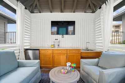 a kitchen with two chairs and a table in a room at Calypso Resort Tower 3 in Panama City Beach