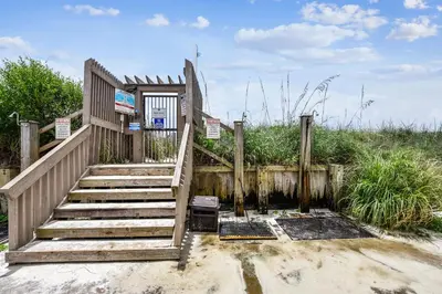 a set of stairs leading up to a building at Sea Hag by Book That Condo in Panama City Beach