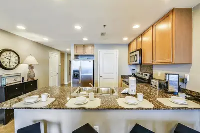 a kitchen with a counter top and a sink at Sterling Breeze #1702 by Book That Condo in Panama City Beach