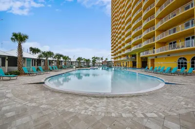 an empty swimming pool in front of a building at Calypso Resort and Towers #1101-3 by Book That Condo in Panama City Beach