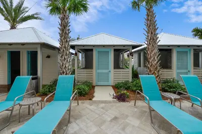 a resort with blue chairs and palm trees at Calypso Resort and Towers #1101-3 by Book That Condo in Panama City Beach