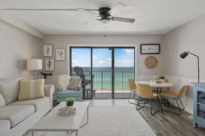 a living room with a couch and a table at The Summit 919 in Panama City Beach