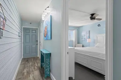 a bedroom with a bed and a ceiling fan at The Summit 919 in Panama City Beach