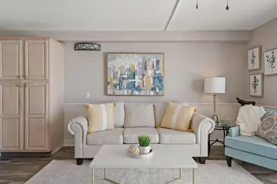 a living room with a couch and a table at The Summit 919 in Panama City Beach
