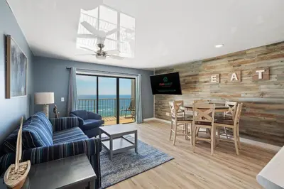 a living room with a couch and a table at The Summit 1408 in Panama City Beach