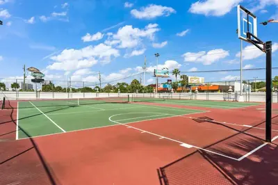 a tennis court with a net on top of it at The Summit 1408 in Panama City Beach