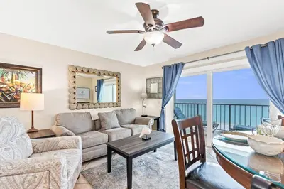 a living room with a couch and a table at The Summit 820 in Panama City Beach
