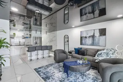 a living room with a couch and a table at The Summit 1208 in Panama City Beach