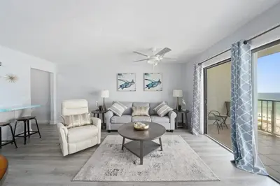 a living room with a couch and a table at The Summit 626 in Panama City Beach
