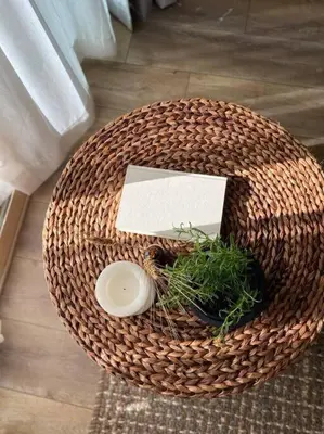 a wicker table with a plant on top of it at Shores of Panama Unit 1209 in Panama City Beach