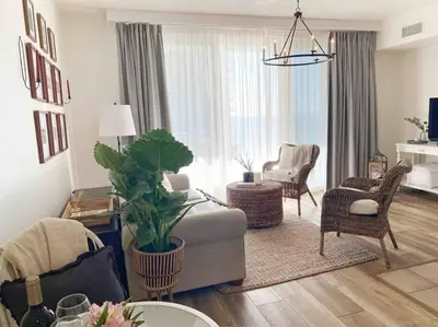 a living room with a couch and chairs at Shores of Panama Unit 1209 in Panama City Beach