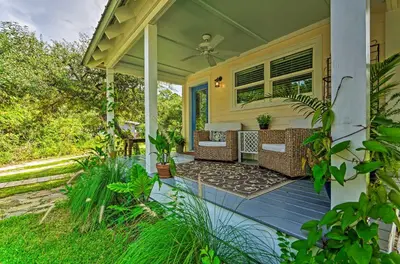a front porch of a house with a fan at Tropical Studio quarter Mi to Public Beach Access! in Santa Rosa Beach
